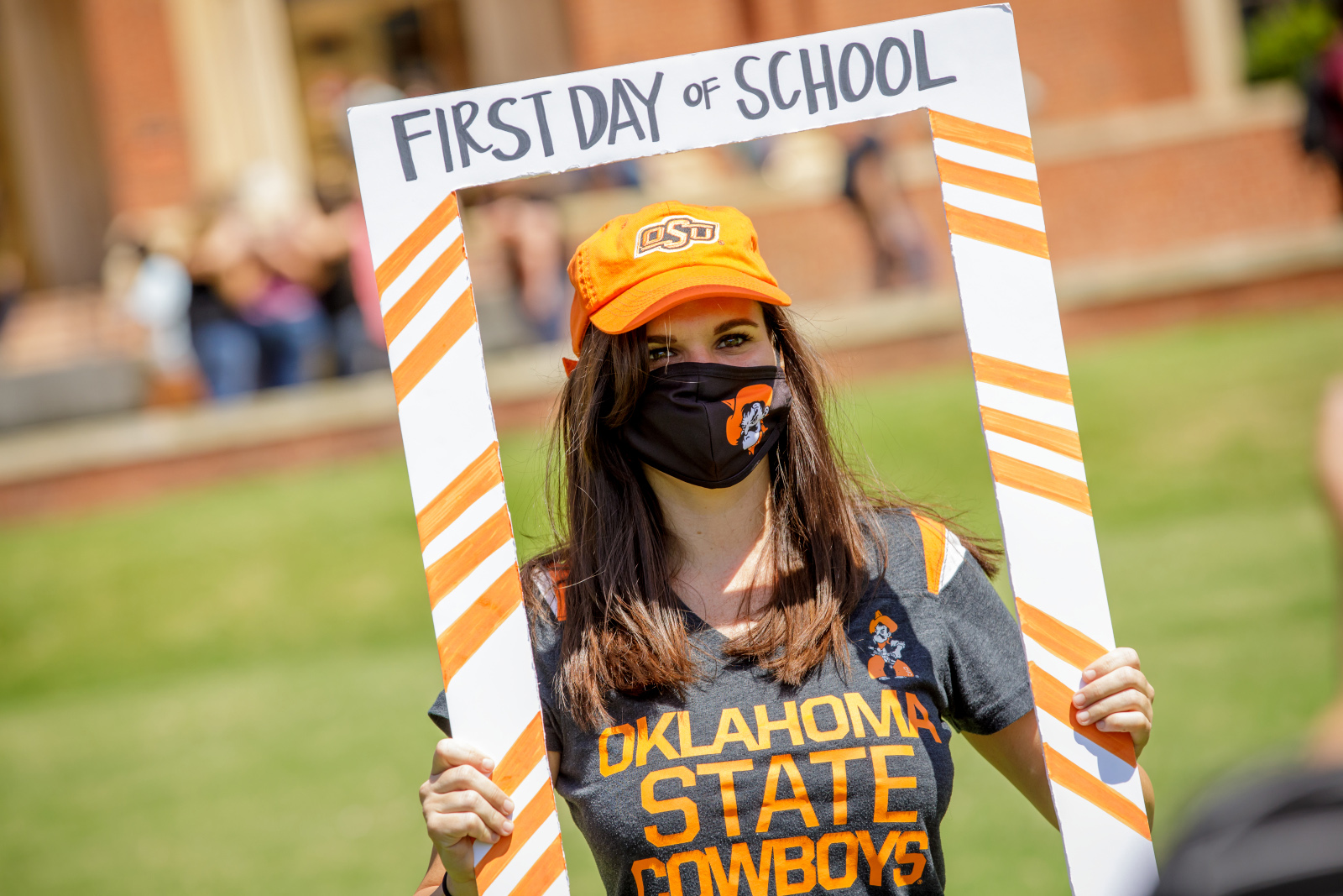 student in first day of school frame library lawn